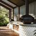 polito giotto wood fired pizza oven in black with benchstand outdoor kitchen with log storage