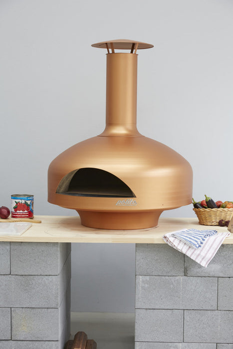 polito giotto wood fired pizza oven in copper with benchstand on countertop